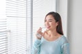 Beautiful young woman drinking water at home Royalty Free Stock Photo