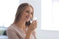 Beautiful young woman drinking water at home Royalty Free Stock Photo