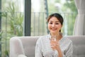 Beautiful young woman drinking water at home Royalty Free Stock Photo