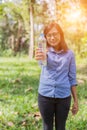 Beautiful young woman drinking water in the morning after finished jogging Royalty Free Stock Photo