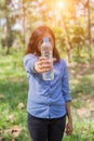 Beautiful young woman drinking water in the morning after finished jogging Royalty Free Stock Photo