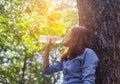 Beautiful young woman drinking water in the morning after finished jogging Royalty Free Stock Photo