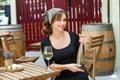 Beautiful young woman drinking white wine on the terrace of a restaurant. Royalty Free Stock Photo