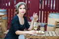 Beautiful young woman drinking white wine on the terrace of a restaurant. Relaxing after work with a glass of wine Royalty Free Stock Photo