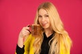 Beautiful young woman drinks coffe over pink background Royalty Free Stock Photo