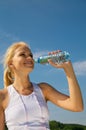 Beautiful young woman drinks water Royalty Free Stock Photo