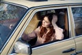 Beautiful young woman driving her car in the summer in the city Royalty Free Stock Photo