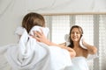 Beautiful young woman drying hair with towel near mirror at home Royalty Free Stock Photo