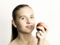 Beautiful young woman eating an apple. healthy food - strong teeth concept Royalty Free Stock Photo