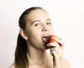 Beautiful young woman eating an apple. healthy food - strong teeth concept Royalty Free Stock Photo