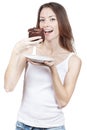 Beautiful young woman eating chocolate cake Royalty Free Stock Photo