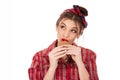 Beautiful young woman eating cookies