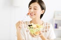 Beautiful young woman eating healthy food Royalty Free Stock Photo