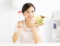 Beautiful young woman eating healthy food Royalty Free Stock Photo