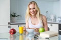 beautiful young woman eating muesli for breakfast and smiling at camera Royalty Free Stock Photo