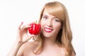 Beautiful young woman eating paprika Royalty Free Stock Photo