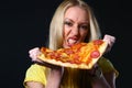 Beautiful young woman eating pizza Royalty Free Stock Photo