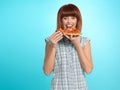 Beautiful young woman eating a pizza pie Royalty Free Stock Photo