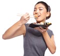 Beautiful young woman eating sushi. Royalty Free Stock Photo