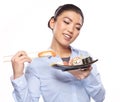 Beautiful young woman eating sushi. Royalty Free Stock Photo