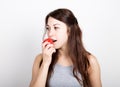 Beautiful young woman eating an vegetables. holding tomatoes. healthy food - strong teeth concept Royalty Free Stock Photo