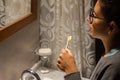 Beautiful young woman with eco friendly toothbrush