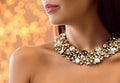 Beautiful young woman with elegant jewelry against defocused lights Royalty Free Stock Photo