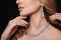 Beautiful young woman with elegant jewelry on dark, closeup Royalty Free Stock Photo