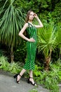 Young woman in elegant striped dress