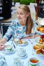 Beautiful young woman enjoying afternoon tea Royalty Free Stock Photo