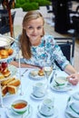 Beautiful young woman enjoying afternoon tea Royalty Free Stock Photo