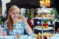 Beautiful young woman enjoying afternoon tea Royalty Free Stock Photo