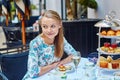 Beautiful young woman enjoying afternoon tea Royalty Free Stock Photo