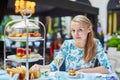 Beautiful young woman enjoying afternoon tea Royalty Free Stock Photo