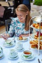 Beautiful young woman enjoying afternoon tea Royalty Free Stock Photo