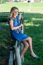 Beautiful young woman enjoying countryside view with green pastures