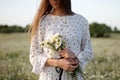 Beautiful young woman enjoying a field of daisies, beautiful girl relaxing outdoors, having fun Royalty Free Stock Photo