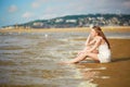 Beautiful young woman enjoying her vacation by ocean or sea Royalty Free Stock Photo