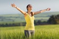 Beautiful young woman enjoying the spring standing in a cereal f Royalty Free Stock Photo