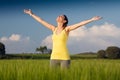 Beautiful young woman enjoying the spring standing in a cereal f Royalty Free Stock Photo