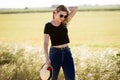 Beautiful young woman enjoying summer in a field. Royalty Free Stock Photo