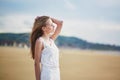 Beautiful young woman enjoying sun on a sand beach Royalty Free Stock Photo