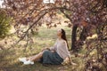 Woman Outdoors in Park Near Spring Blossom Tree Royalty Free Stock Photo