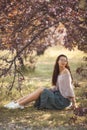 Woman Outdoors in Park Near Spring Blossom Tree Royalty Free Stock Photo