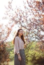 Woman Outdoors in Park Near Spring Blossom Tree Royalty Free Stock Photo