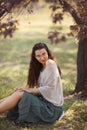 Woman Outdoors in Park Near Spring Blossom Tree Royalty Free Stock Photo