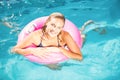 Beautiful young woman enjoying in the swimming pool Royalty Free Stock Photo