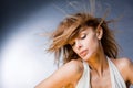 Beautiful young woman enjoying the wind Royalty Free Stock Photo