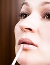 Beautiful young woman eyelash extension. Woman eye with long eyelashes. Beauty salon concept, lipstick lip gloss