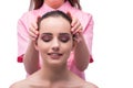 The beautiful young woman during face massage session Royalty Free Stock Photo